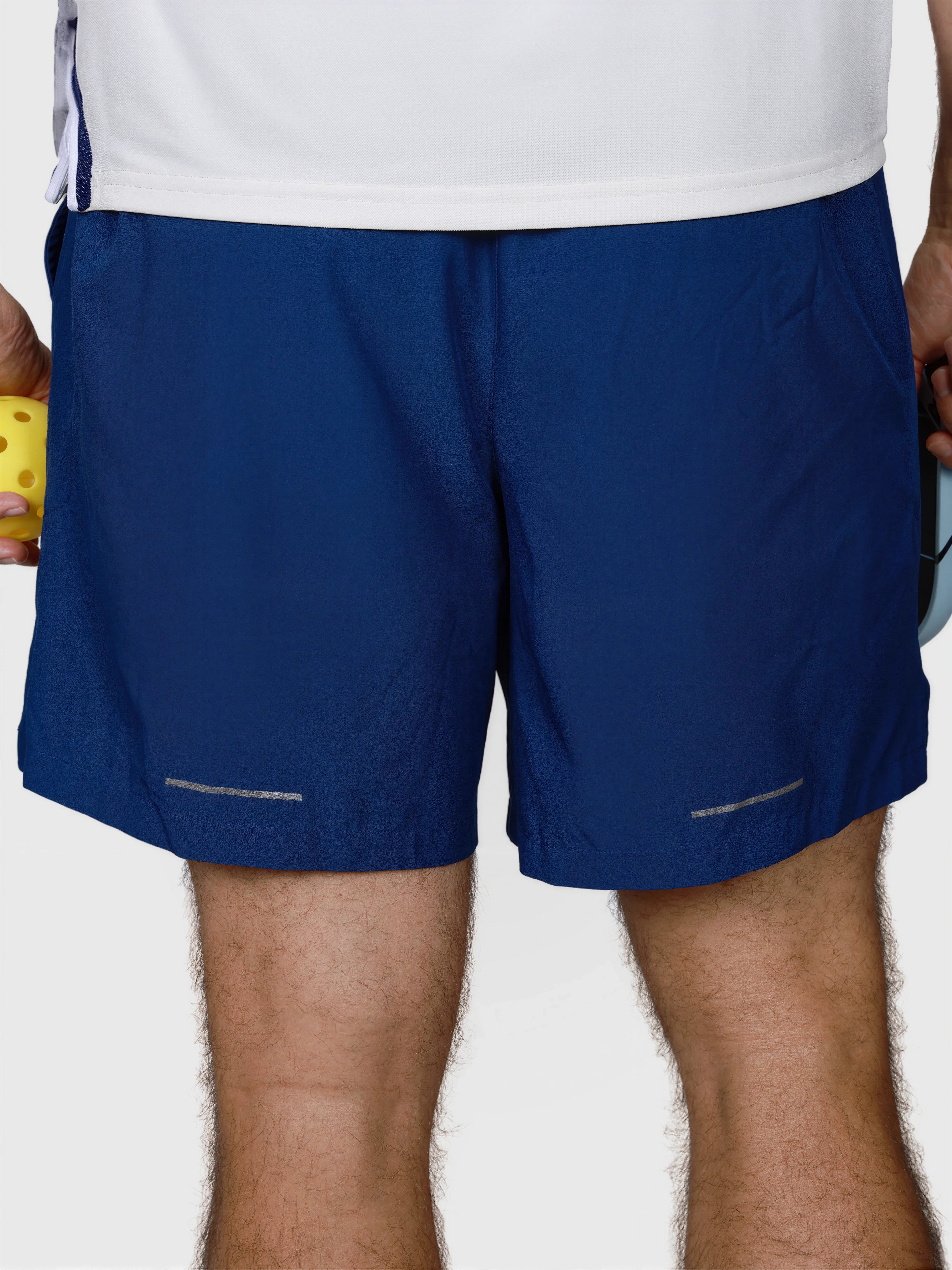 rear view of man wearing Navy Base Line Short by MUEV designed for padel and pickleball shorts