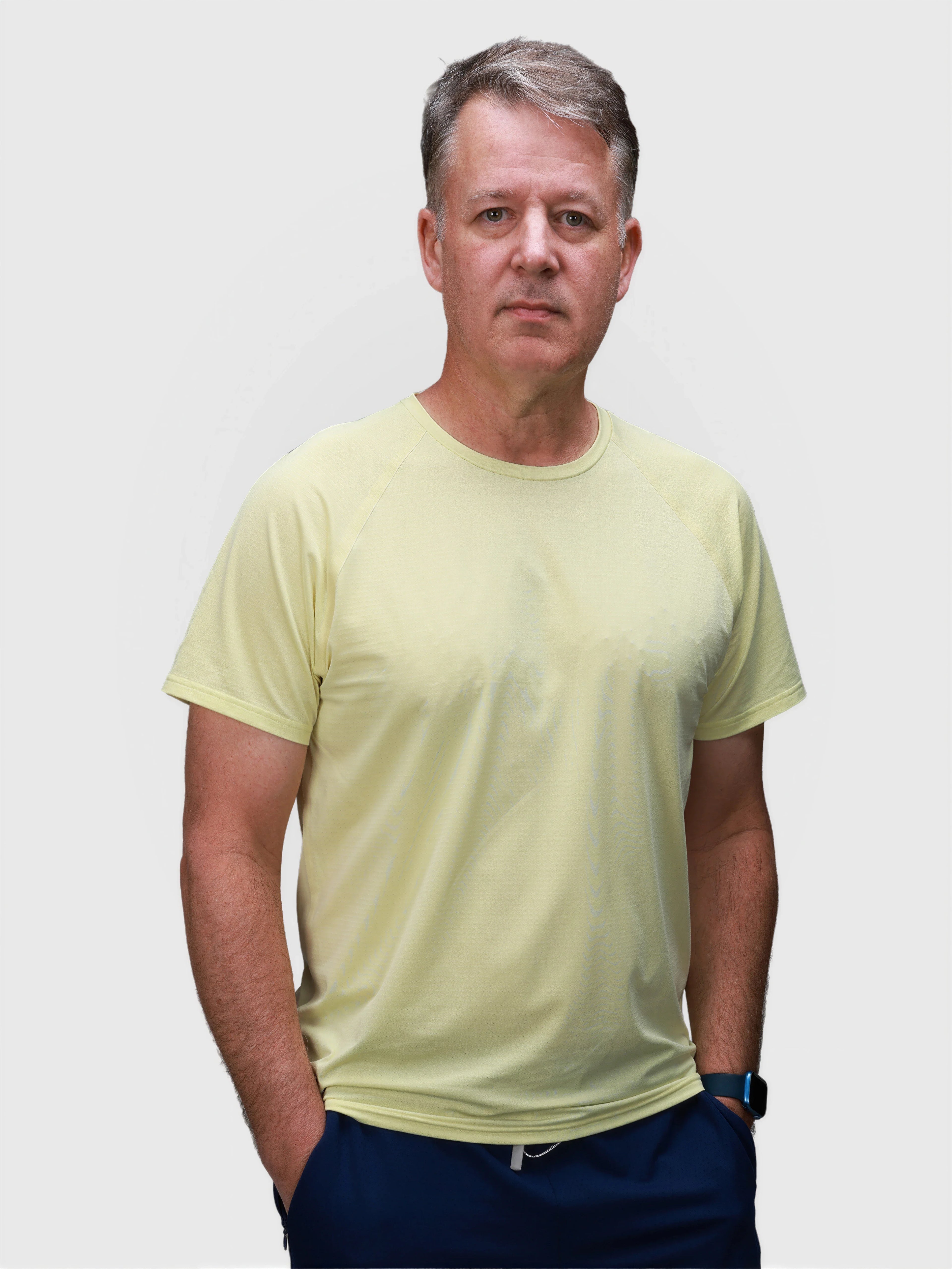 Man wearing citron Dink Performance Tee by MUEV designed for padel and pickleball apparel